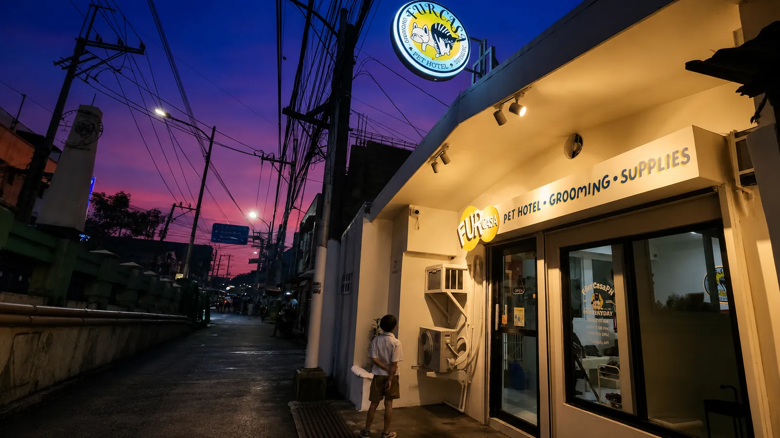 Fur Casa pet hotel and grooming shop beside the San Joaquin bridge at dusk